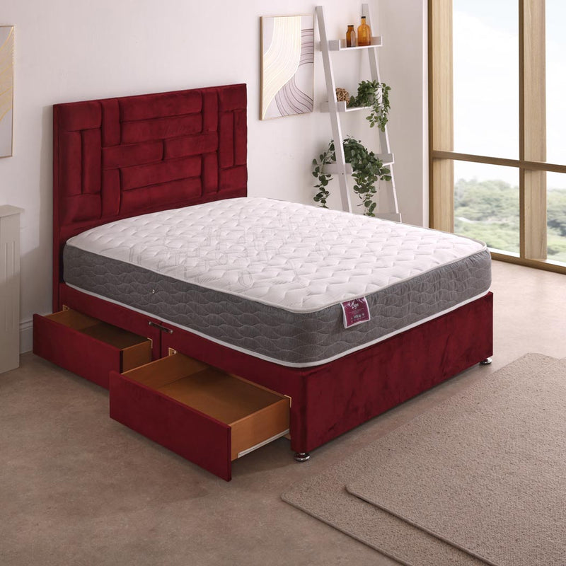 Zoya Open Coil Mattress – angled view, styled in a bedroom