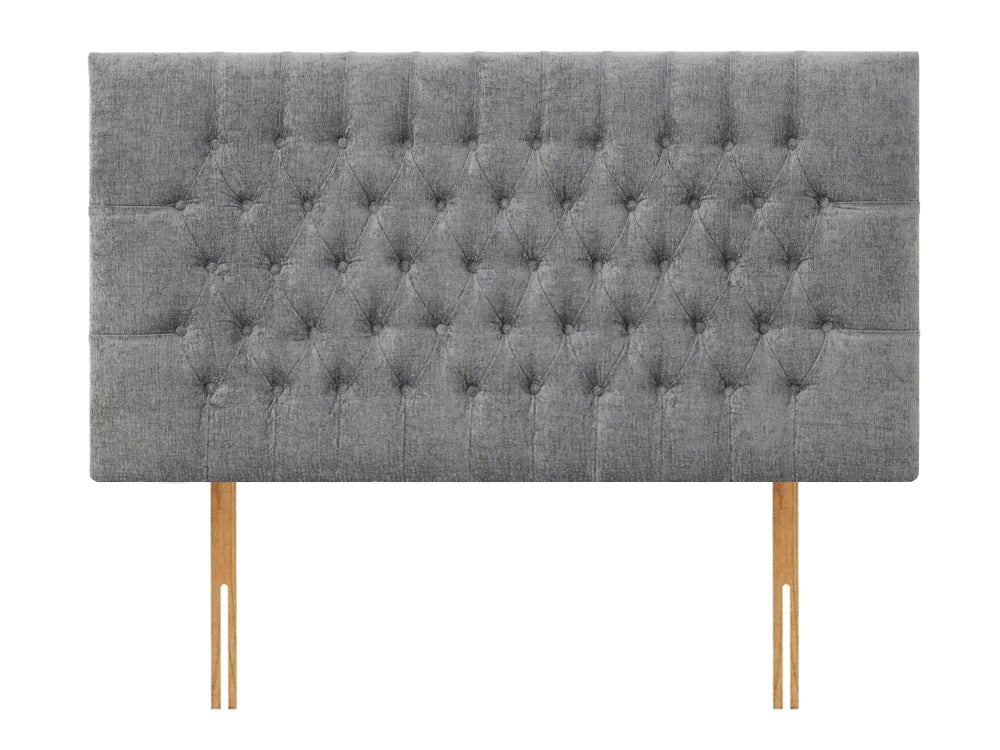 Strutted headboard upholstered in a grey fabric with deep tufted buttons. Lincoln strutted headboard by Apollo.