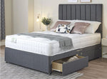 Divan bed base upholstered in a dark grey fabric with matching headboard in bedroom